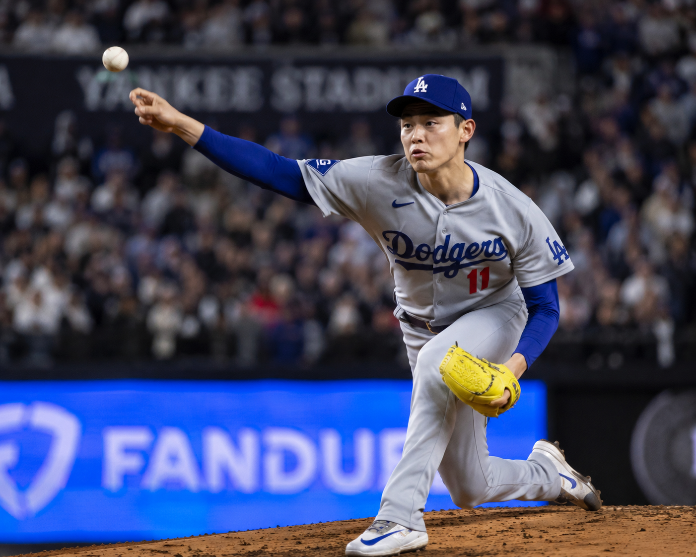 Roki Sasaki mid-delivery at Yankee Stadium, ball leaving his hand